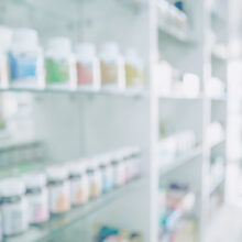 Pharmacy storeroom with shelves full of drugs